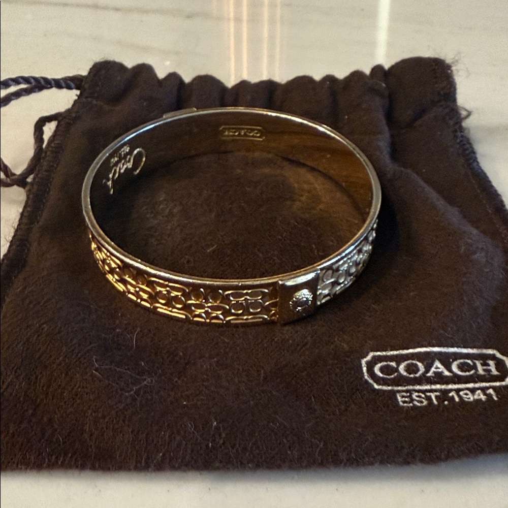 Coach Gold-Tone Signature Pattern Bangle Bracelet